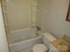 A basic bathroom is shown with beige tiles, a standard bathtub, a toilet and a sink at 1138 Choyce Ave, Charlotte, NC 28217