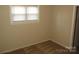 Cozy bedroom with beige walls, neutral carpet and ample sunlight at 1138 Choyce Ave, Charlotte, NC 28217