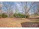 Spacious backyard with mature trees and landscaping at 1142 Canterbury Dr, Lancaster, SC 29720