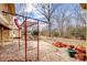Backyard featuring a concrete patio with playset and mature trees at 1142 Canterbury Dr, Lancaster, SC 29720