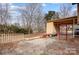 Backyard concrete patio area and play structure adjacent to the house at 1142 Canterbury Dr, Lancaster, SC 29720