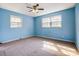 Bedroom featuring a ceiling fan, windows, and space for furniture at 1142 Canterbury Dr, Lancaster, SC 29720