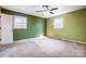 Bedroom featuring a ceiling fan, two windows, and ample space at 1142 Canterbury Dr, Lancaster, SC 29720