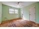 Bedroom featuring a ceiling fan, windows, and door at 1142 Canterbury Dr, Lancaster, SC 29720
