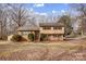 Charming two-story home with a brick and vinyl facade, complemented by well-maintained landscaping at 1142 Canterbury Dr, Lancaster, SC 29720