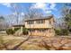 Charming two-story home with a brick and vinyl facade, complemented by well-maintained landscaping at 1142 Canterbury Dr, Lancaster, SC 29720
