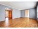 Neutral Living Room with Wood Laminate Flooring and Plenty of Natural Light at 1142 Canterbury Dr, Lancaster, SC 29720