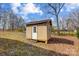 Well-maintained storage shed with a door and a window at 1142 Canterbury Dr, Lancaster, SC 29720