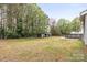 Backyard view including a shed, above-ground pool and an expansive lawn area at 117 Pine Bluff Dr, Mooresville, NC 28117