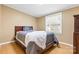 Cozy bedroom with wood floors and a sunlit window provides a relaxing retreat at 117 Pine Bluff Dr, Mooresville, NC 28117