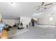 Bonus room featuring carpet flooring, neutral walls, ceiling fans, and ample storage space at 117 Pine Bluff Dr, Mooresville, NC 28117
