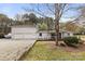Charming single Gathering home featuring a covered front porch, a large lot and separate 2-car garage at 117 Pine Bluff Dr, Mooresville, NC 28117