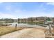 Scenic view of the lake from the boat launch with mature trees in the background at 117 Pine Bluff Dr, Mooresville, NC 28117