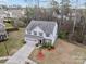 Aerial view of home with lush landscaping, mature trees, and a well-manicured lawn at 12302 Volusia Ct, Charlotte, NC 28262