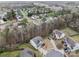 Panoramic aerial view showcasing the home's setting within a lush, tree-filled neighborhood at 12302 Volusia Ct, Charlotte, NC 28262