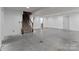 Unfinished basement featuring concrete floors, stairs, and white walls ready for customization at 12302 Volusia Ct, Charlotte, NC 28262