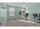 Bright bedroom with a ceiling fan, green walls, and carpet flooring at 12302 Volusia Ct, Charlotte, NC 28262