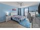 Charming bedroom with a racecar theme, blue walls, and carpet flooring at 12302 Volusia Ct, Charlotte, NC 28262