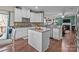 Open kitchen with a center island, granite countertops, and stainless steel appliances at 12302 Volusia Ct, Charlotte, NC 28262