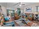 Open-concept living room with hardwood floors, leather furniture, and a view of the kitchen at 12302 Volusia Ct, Charlotte, NC 28262