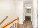 Upstairs hallway with wood-look flooring leading to bedrooms at 1310 Green Oaks Ln # H, Charlotte, NC 28205