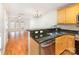 Modern kitchen featuring stainless steel appliances, granite countertops, and an open layout at 1310 Green Oaks Ln # H, Charlotte, NC 28205