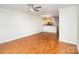Open-concept living space with hardwood floors and a view of the kitchen at 1310 Green Oaks Ln # H, Charlotte, NC 28205