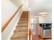 Inviting staircase leads to a living area with hardwood floors and natural light at 1310 Green Oaks Ln # H, Charlotte, NC 28205