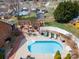 Aerial view of the private backyard featuring a pool, patio, pergola, and a white fence at 1529 Indian Springs Nw Dr, Conover, NC 28613