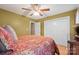 Comfortable bedroom featuring hardwood floors, a ceiling fan, and a spacious closet at 1529 Indian Springs Nw Dr, Conover, NC 28613