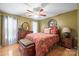 Comfortable bedroom featuring hardwood floors, a ceiling fan, and plenty of natural light at 1529 Indian Springs Nw Dr, Conover, NC 28613