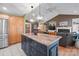 Kitchen island with granite countertops, stainless appliances, and view into adjacent Gathering room at 1529 Indian Springs Nw Dr, Conover, NC 28613
