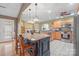Bright kitchen featuring a large island with bar seating, pendant lights, and an open layout to the dining area at 1529 Indian Springs Nw Dr, Conover, NC 28613