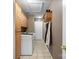 Mudroom featuring tile floors, storage cabinets, and hanging rack for jackets and clothing at 1529 Indian Springs Nw Dr, Conover, NC 28613