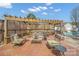 Brick patio with outdoor seating, pergola, and views of the backyard pool at 1529 Indian Springs Nw Dr, Conover, NC 28613