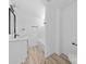Well-lit bathroom featuring modern vanity, sleek fixtures, and tub/shower combo at 1611 Carlton Ave, Kannapolis, NC 28083