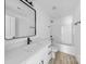 Well-lit bathroom featuring modern vanity, sleek fixtures, and tub/shower combo at 1611 Carlton Ave, Kannapolis, NC 28083