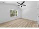 Vaulted ceiling bright bedroom with a ceiling fan, window and light-colored walls at 1611 Carlton Ave, Kannapolis, NC 28083