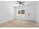Bedroom featuring wood-look floors, large window, and a door to the hallway at 1611 Carlton Ave, Kannapolis, NC 28083