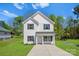 Charming two-story home featuring a welcoming porch and a well-manicured lawn at 1611 Carlton Ave, Kannapolis, NC 28083