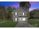 Charming two-story home with neutral siding, black shutters, and a well-manicured front lawn at 1615 Carlton Ave, Kannapolis, NC 28083