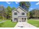 Beautiful two-story home with green grass, a well-kept lawn, and black shutters at 1615 Carlton Ave, Kannapolis, NC 28083