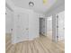 Hallway features wood-look flooring and white doors leading to other rooms at 1615 Carlton Ave, Kannapolis, NC 28083