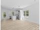 Open-concept kitchen with sleek appliances, white cabinetry, and natural light at 1615 Carlton Ave, Kannapolis, NC 28083