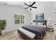 Bright bedroom with large window overlooking a scenic view, vaulted ceilings, and a ceiling fan at 1615 Carlton Ave, Kannapolis, NC 28083