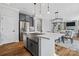 A kitchen with island, stainless steel fridge and an eat-in table at 2133 Moss Bluff Dr, Mint Hill, NC 28227