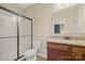 Bathroom with granite counters, dark cabinets, and a stand up shower at 224 Alexandria Dr, Mooresville, NC 28115
