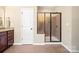 Bathroom featuring a glass enclosed shower, dark cabinets, and tiled floors at 224 Alexandria Dr, Mooresville, NC 28115