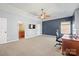 Spacious bedroom features a ceiling fan, tv and a bathroom at 224 Alexandria Dr, Mooresville, NC 28115