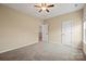 Well lit bedroom with a ceiling fan and neutral color walls at 224 Alexandria Dr, Mooresville, NC 28115